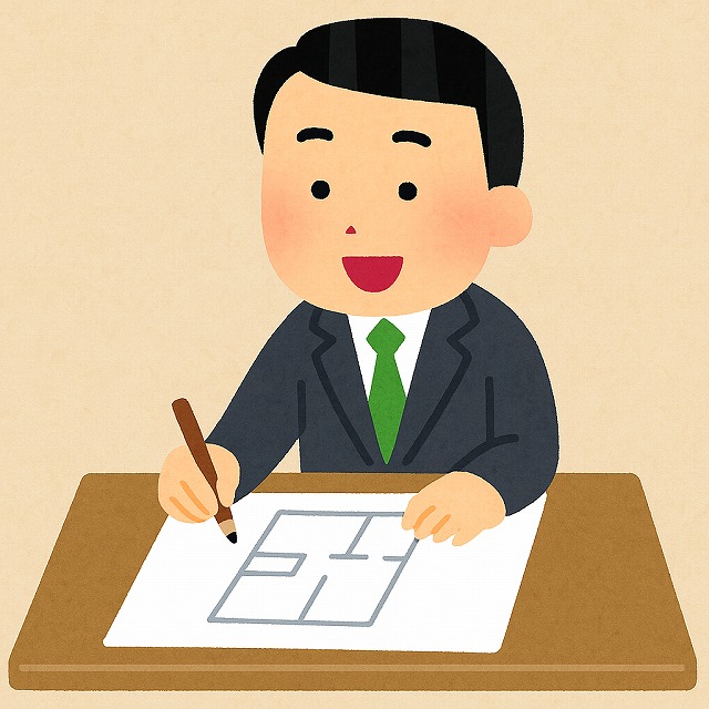 図面を作成する不動産屋さん